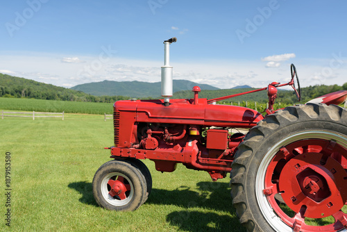 Close-up of an Old Red Tractor in a Country Field