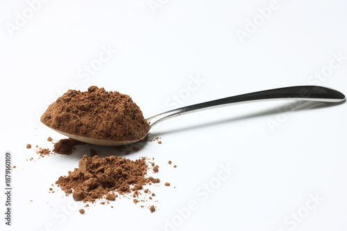 Cuadro en lienzo Cocoa Powder on Spoon , in Canister isolated on white background
