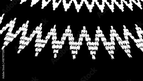 High contrast black and white knitted zigzag geometric pattern.
