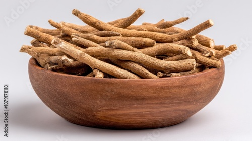 Shatavari Root (Asparagus racemosus) in Wooden Bowl, Top View - herb used for womenâ€™s health, vitality, and natural wellness.
