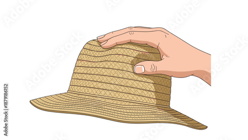 A hand gently holding a straw hat, symbolizing summer, vacation, protection from the sun, and leisurely outdoor activities on a white background.