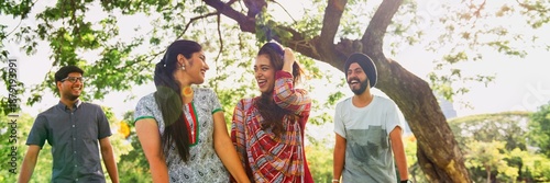 Фотография Group of Indian friends laughing outdoors
