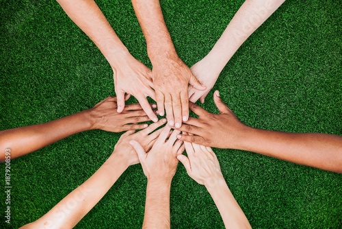 Canvas Print People stacking hands together in the park