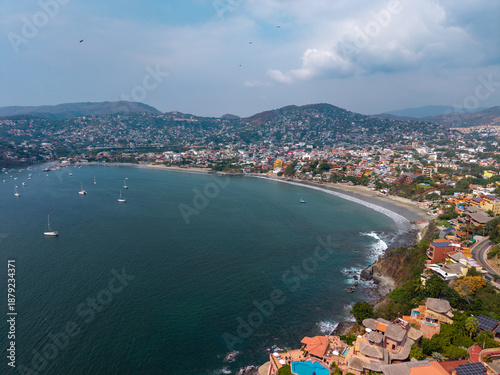 Wallpaper Mural Aerial view of Ixtapa Zihuatanejo beach, Costa Grande of Guerrero. Coastal landscape with hotels and crystal clear sea. Zihuatanejo, Guerrero, Mexico. Torontodigital.ca