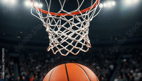 Basketball going through the hoop in a crowded arena  