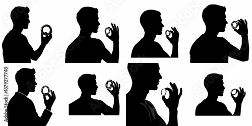 Collection of male silhouettes in profile examining a shiny ring, symbolizing love, engagement, mechanical precision, or important decision.