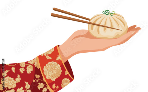 A hand holding a steamed dumpling with chopsticks ready to eat