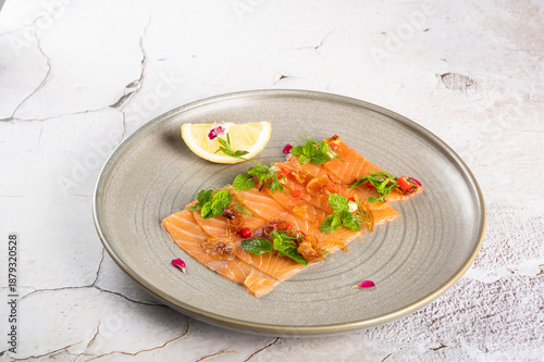 Fresh Salmon Carpaccio with Herbs, Citrus, and Edible Flowers