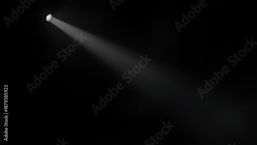 A dramatic stage spotlight cutting through a smoky atmosphere in deep darkness.
