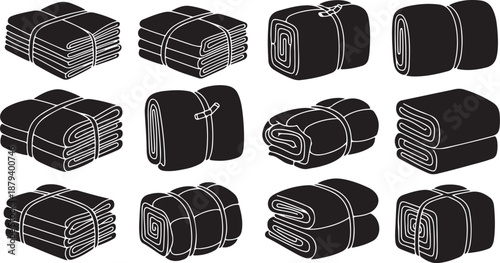 Various folded and stacked towels in black and white