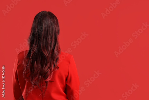 Young woman with red hair o...
