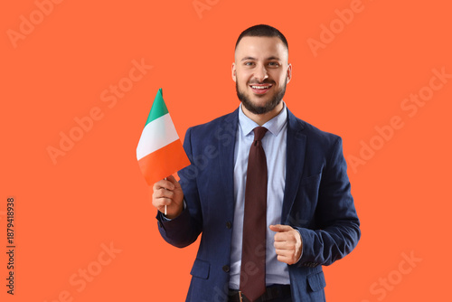 Young businessman with flag...