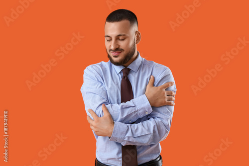 Young businessman hugging h...
