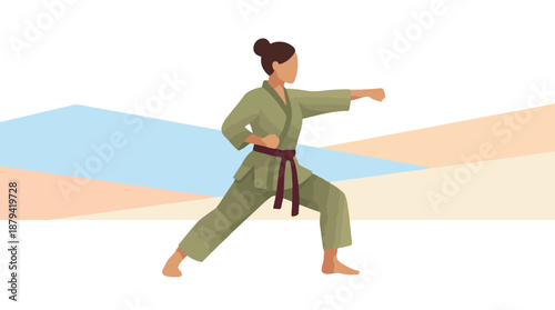 Female martial artist in karate gi performing a powerful punch