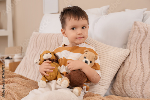 Cute little boy hugging toy...