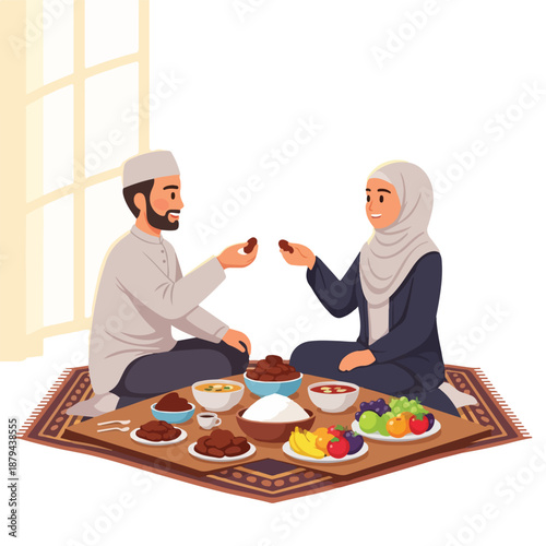 A man and woman share food on a rug