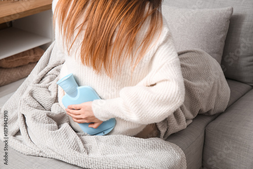 Young woman with blanket an...