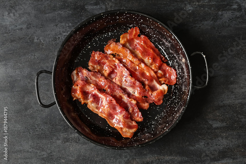Frying pan with fried bacon...