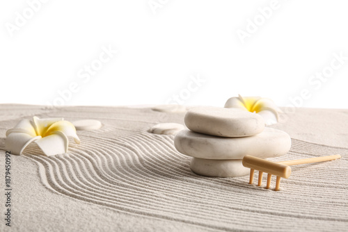 Photography Stones, small rake and tropical flowers on sand with lines against white background