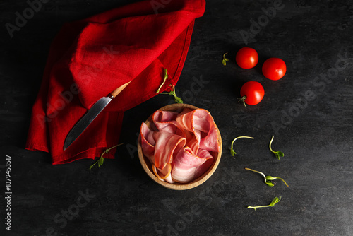 Tasty bacon slices in bowl,...