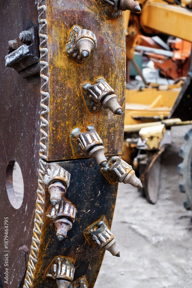 Fototapeta premium image is a close-up of the cutter head of a tunnel boring machine, a large piece of construction equipment used for excavating tunnels