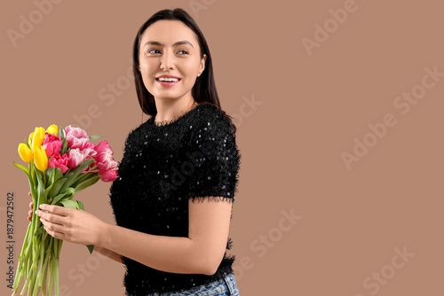 Happy young woman with bouq...