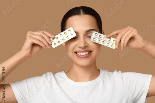 Pretty young woman holding ...