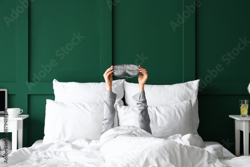 Slika na platnu Morning of young woman with sleeping mask in bed