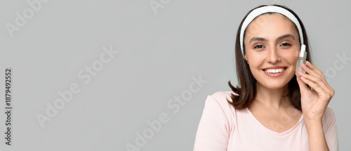 Young woman with serum on l...