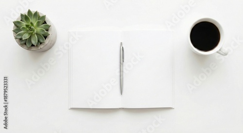 Open notebook with pen, coffee cup and succulent plant on white desk. Minimalist flat lay with copy space