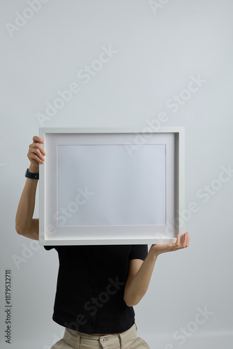 Professional woman showing blank poster for marketing and advertising