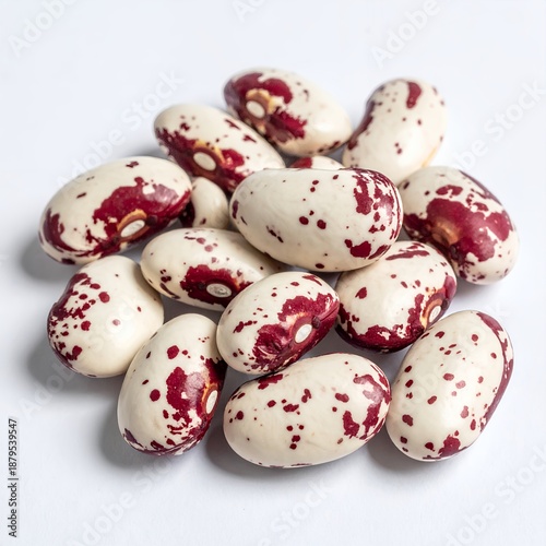 Borlotti beans arranged on a stark white background, showcasing their distinctive patterns