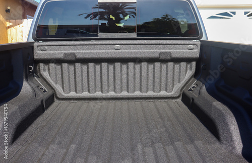 View of the back of a truck with a spray-on bed liner.
