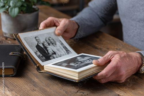 Person Looking at Old Family Photos