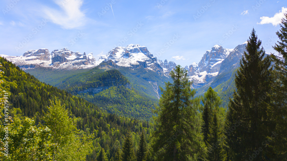 Obraz premium The dramatic limestone peaks of the Brenta Dolomites rising above the alpine landscape of northern Italy.
