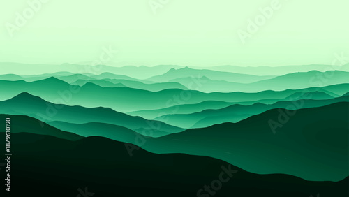 Misty mountain landscape view featuring a silhouette of forest hills and peaks under a blue sunset sky with clouds and morning fog over the valley horizon