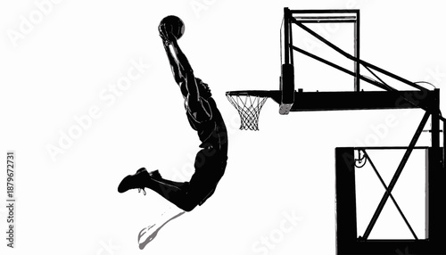 Silhouetted athlete performs a slam dunk, with basketball and hoop in focus, black and white