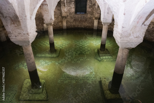 Obraz na plátně View of the ancient flooded crypt with submerged mosaic floors and stone columns