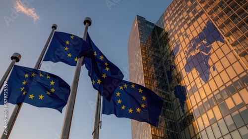 European Union Flags Waving in Front of Modern Building with Map Reflection.