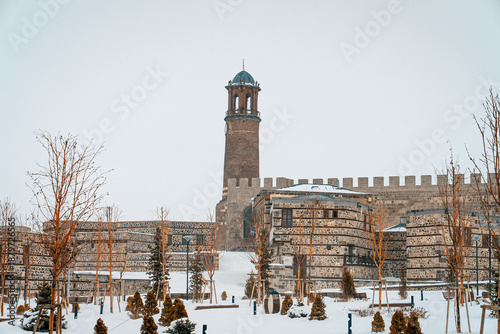 Erzurum Castle Erzurum Kalesi under snow in winter, Turkey. Historic medieval stone fortress and clock tower covered with snow in eastern Anatolia.