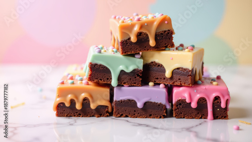 Delicious brownies topped with colorful icing and sprinkles create vibrant dessert display. Perfect for celebrations and sweet treats
