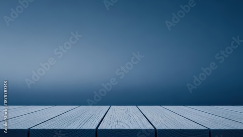 Wooden table surface with a subtle blue background, perfect for product placement and showcasing items