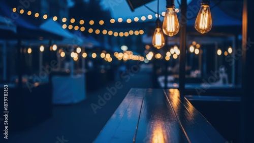 Warm glow of string lights illuminating a vibrant evening market scene, creating a festive outdoor ambiance with blurred background details and cozy wooden foreground