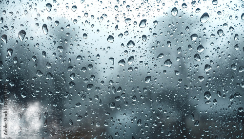 A rainy day view through a window with water droplets on the glass on transparent background