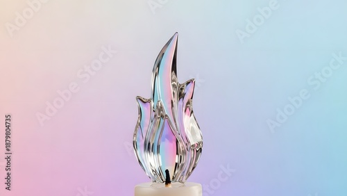 Abstract glass flame sculpture against a soft gradient background
