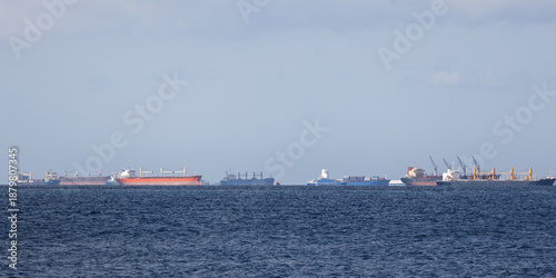 Many cargo ships at anchor in Marmara sea on sunny day, Istanbul, Türkiye