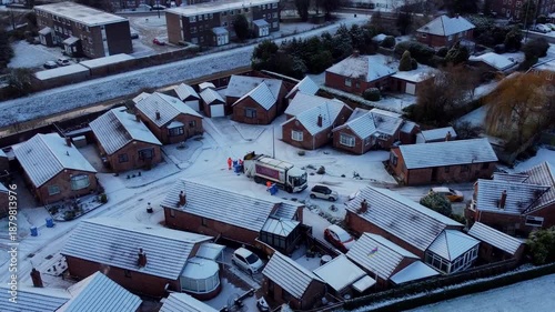 UK dustbin collection, garbage truck, snowy winter, icy roads.