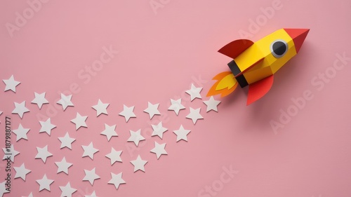 Colorful paper rocket launching into starry sky on pink background