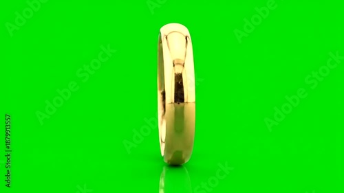 Rotating golden wedding ring on a vibrant green background, elegant concept.