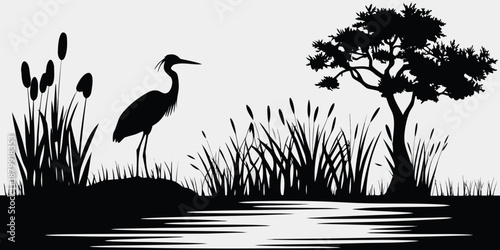 A serene black and white silhouette of a heron by a calm lake